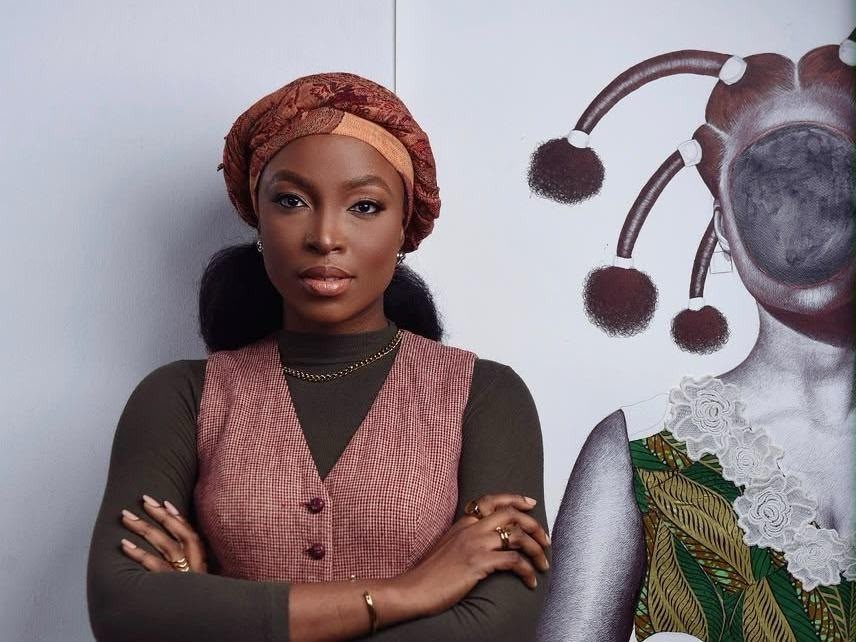 Jacqueline Suowari, a figurative artist, beside one of her drawings.  Courtesy Jacqueline Suowari