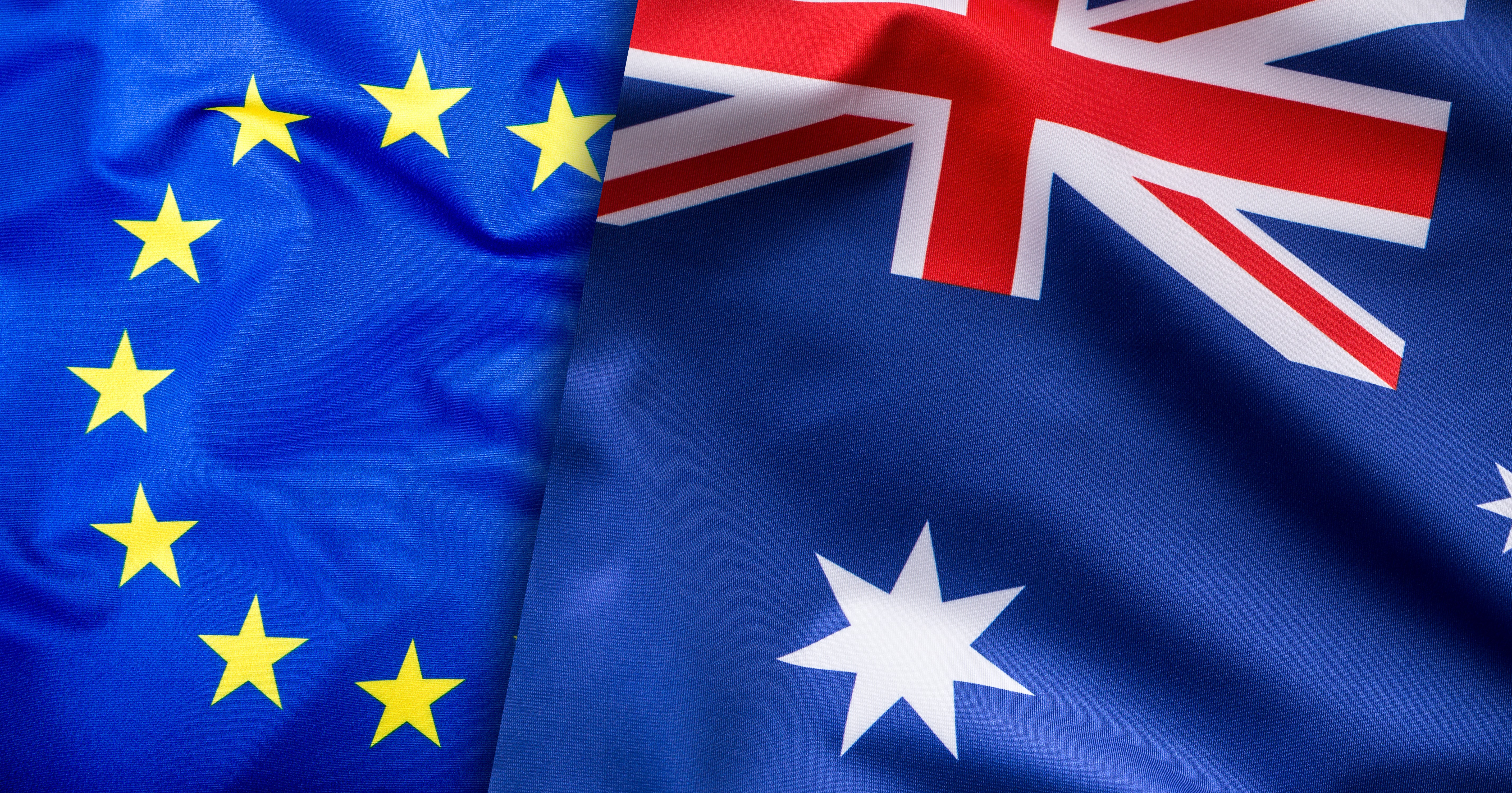 EU and Australian flags side by side, representing trade relations between Europe and Australia