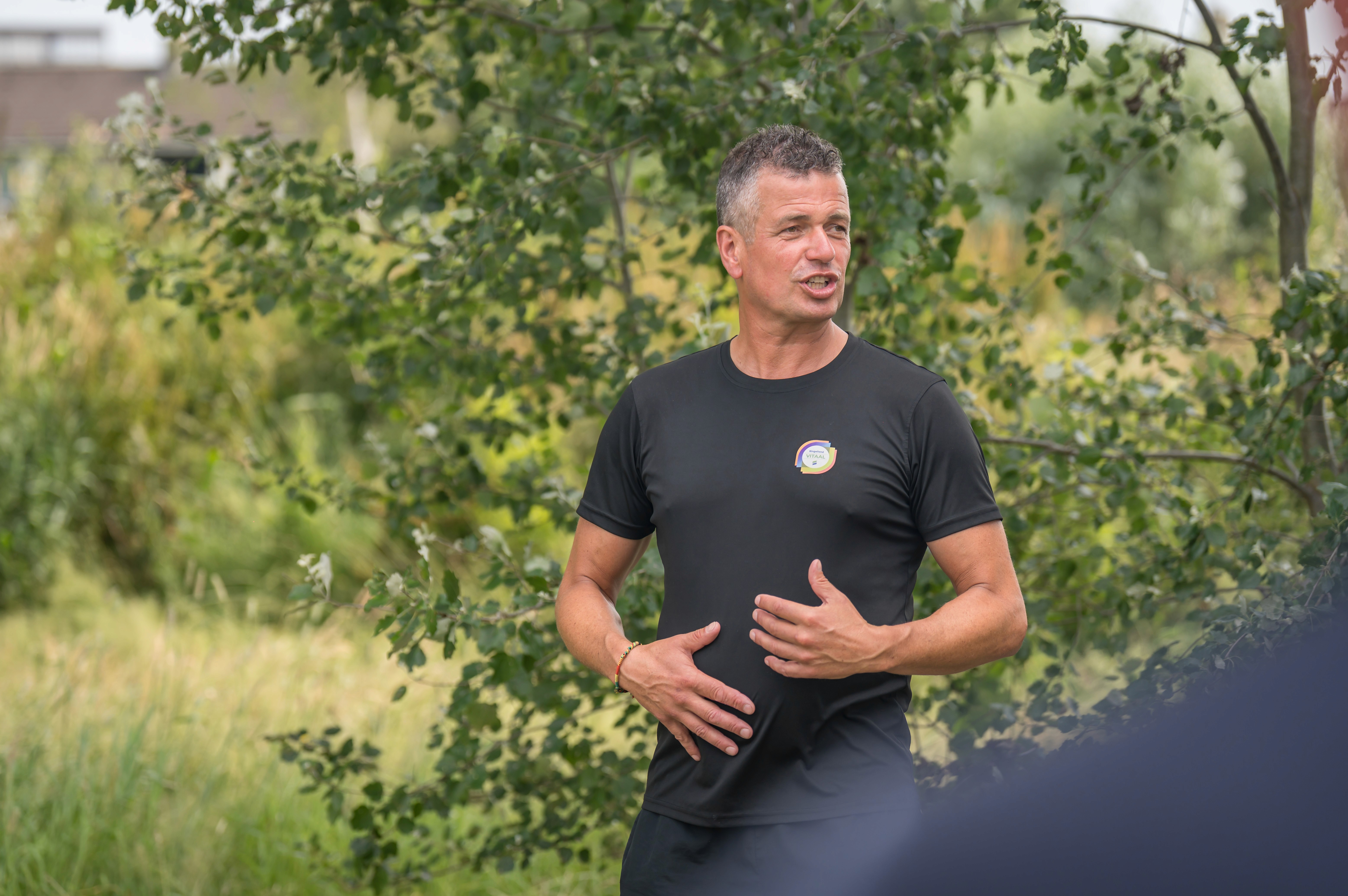 Snowboarder enjoys a downhill run on a sunny day.