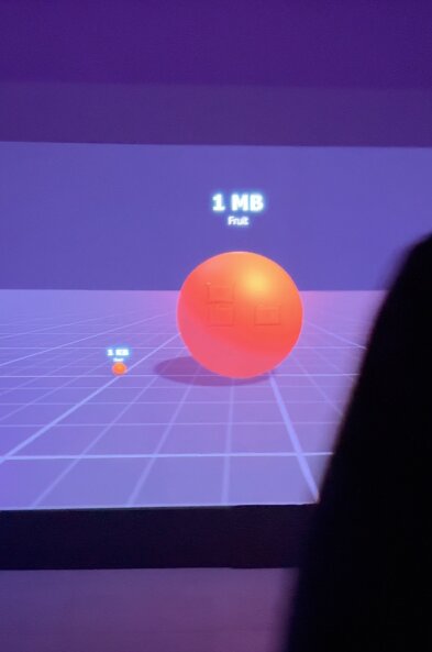 A projected Byte Room data object representing a one-megabyte fruit.