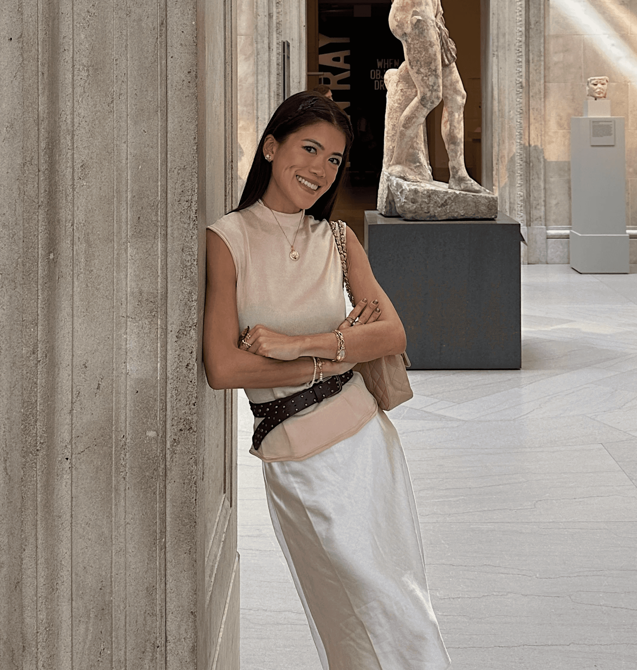 smiling woman wearing white and black pinstriped collared top