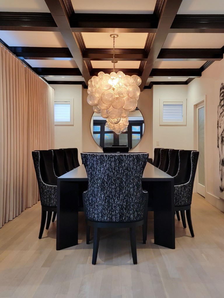 Image of Luxury dining room design by KHD Homes featuring elegant furniture and sophisticated layout design elements.