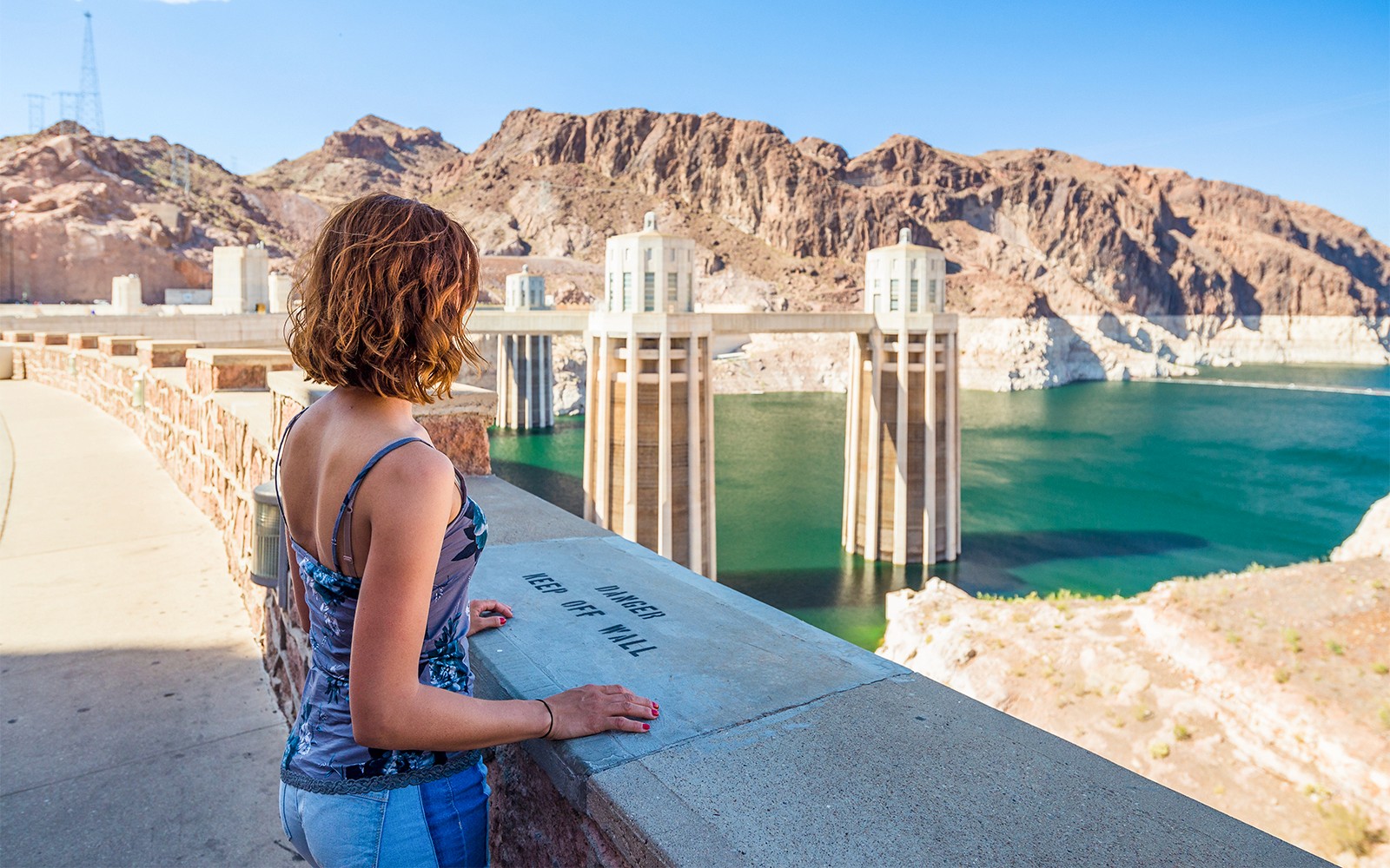 Hoover Dam with tour group exploring the dam's structure and surrounding landscape in Las Vegas.