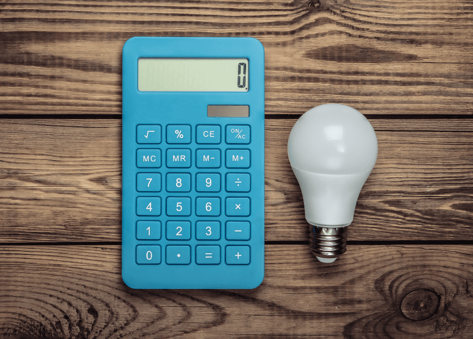 A calculator next to a lightbulb