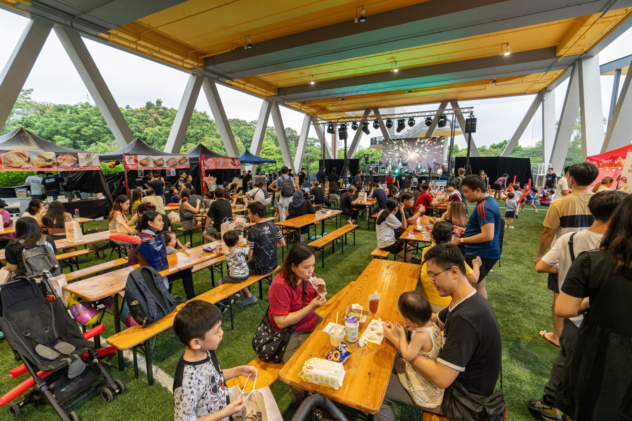 Close-up of a dark green leaf showing its textured surface and central vein against a muted background.
