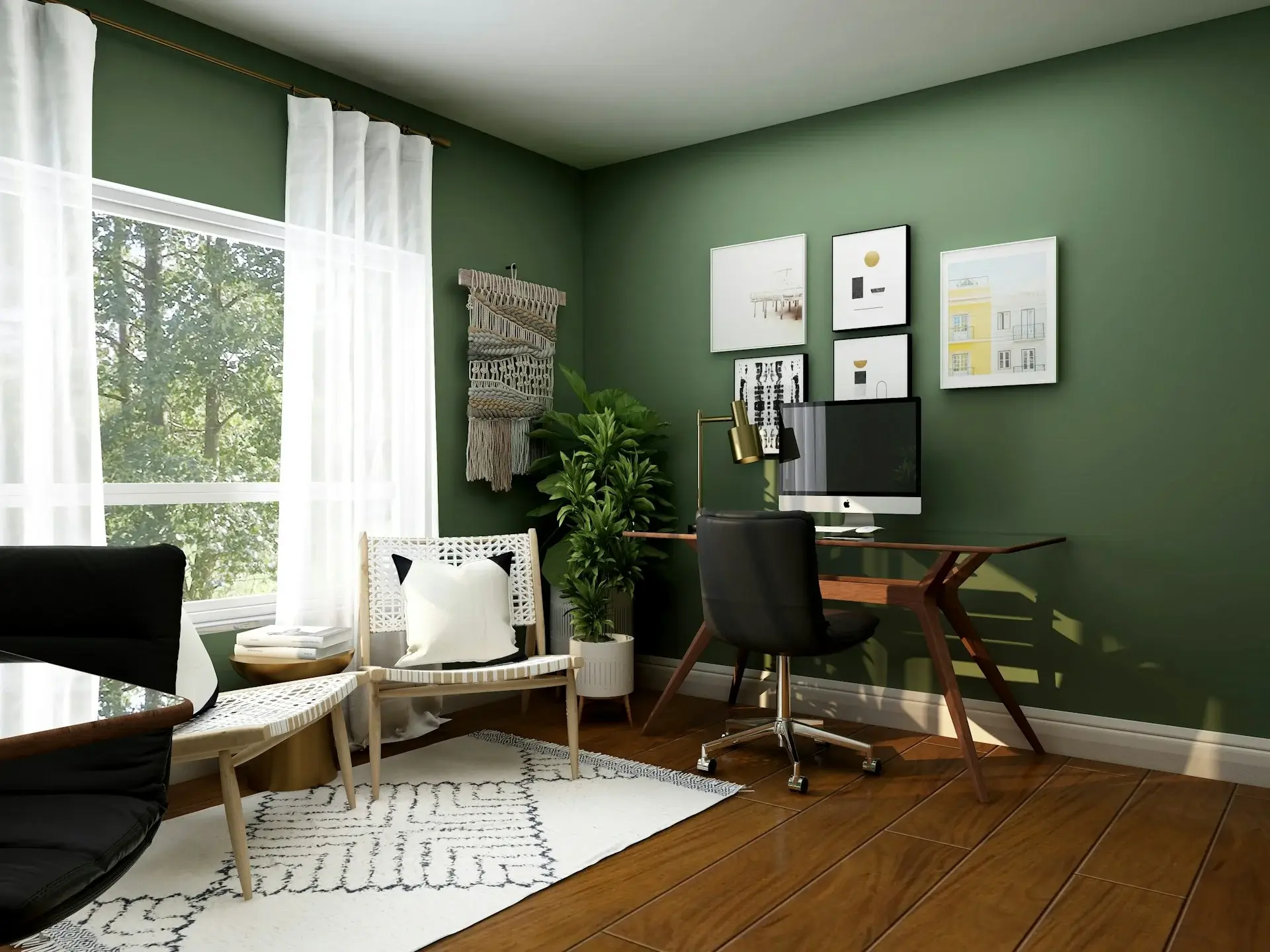 Green home office with wooden desk, plants, and wall art.