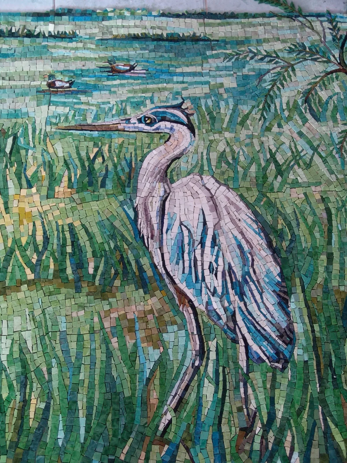 Great blue heron standing in marsh grass, hand-cut smalti mosaic mural of a Gulf of Mexico bird sanctuary.