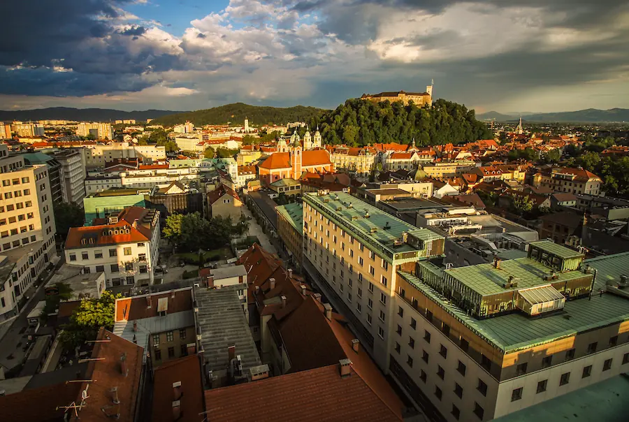 Evening light shining on the Ljubljana old city center and Ljubljana castle as viewed from Nebotičnik (Skyscraper) in Slovenia.
