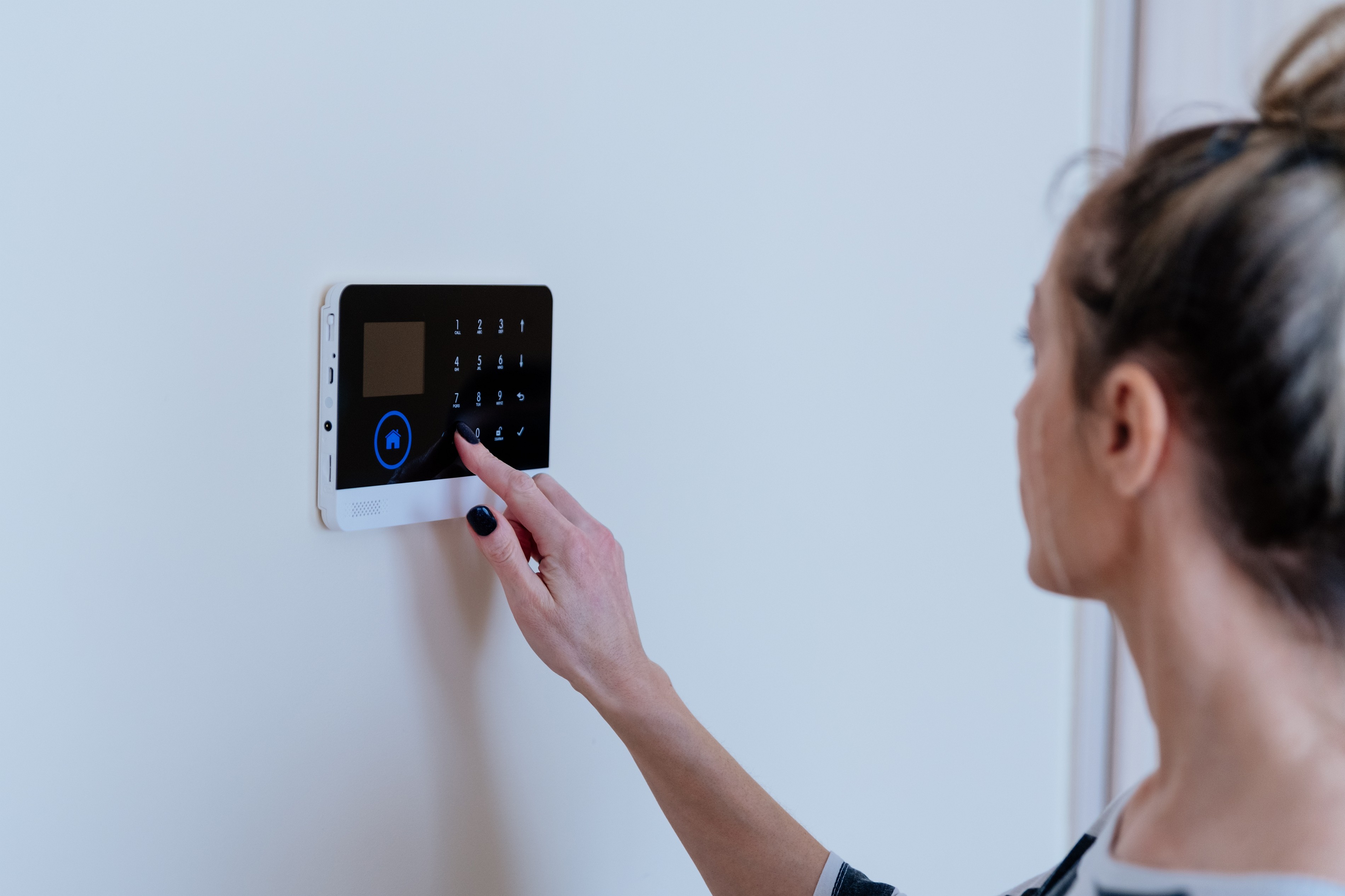 Women adjusting alarm settings