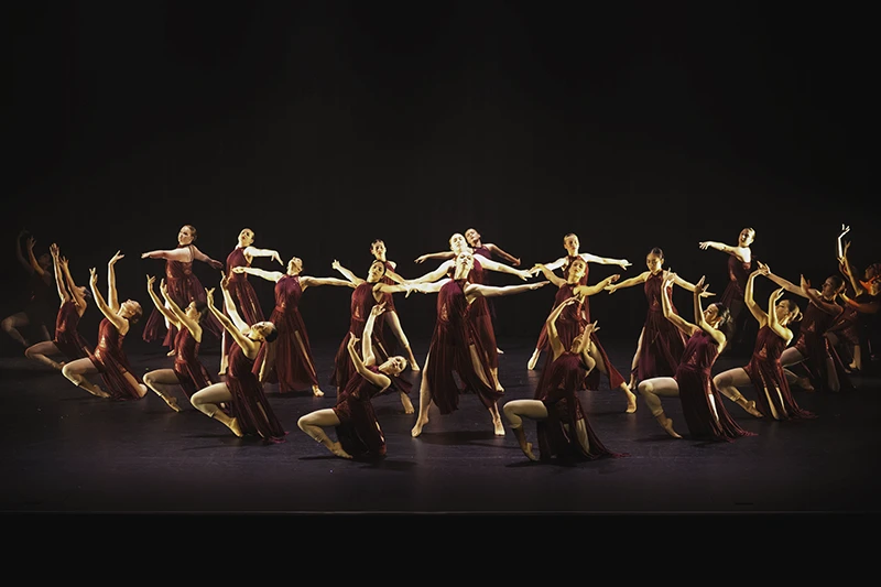 Senior Lyrical students on stage in unison