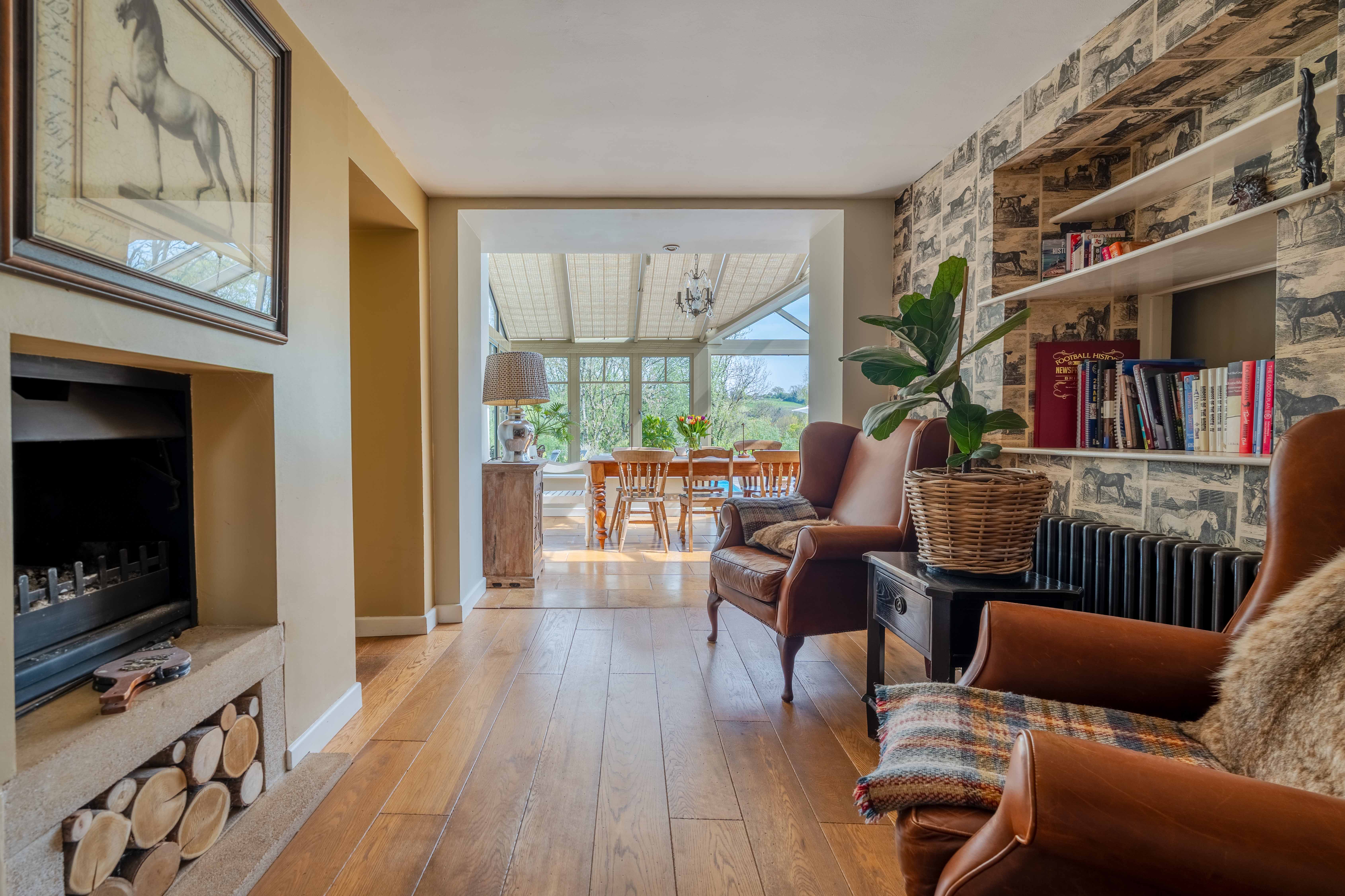 bright living room with floor-to-ceiling glazing and views