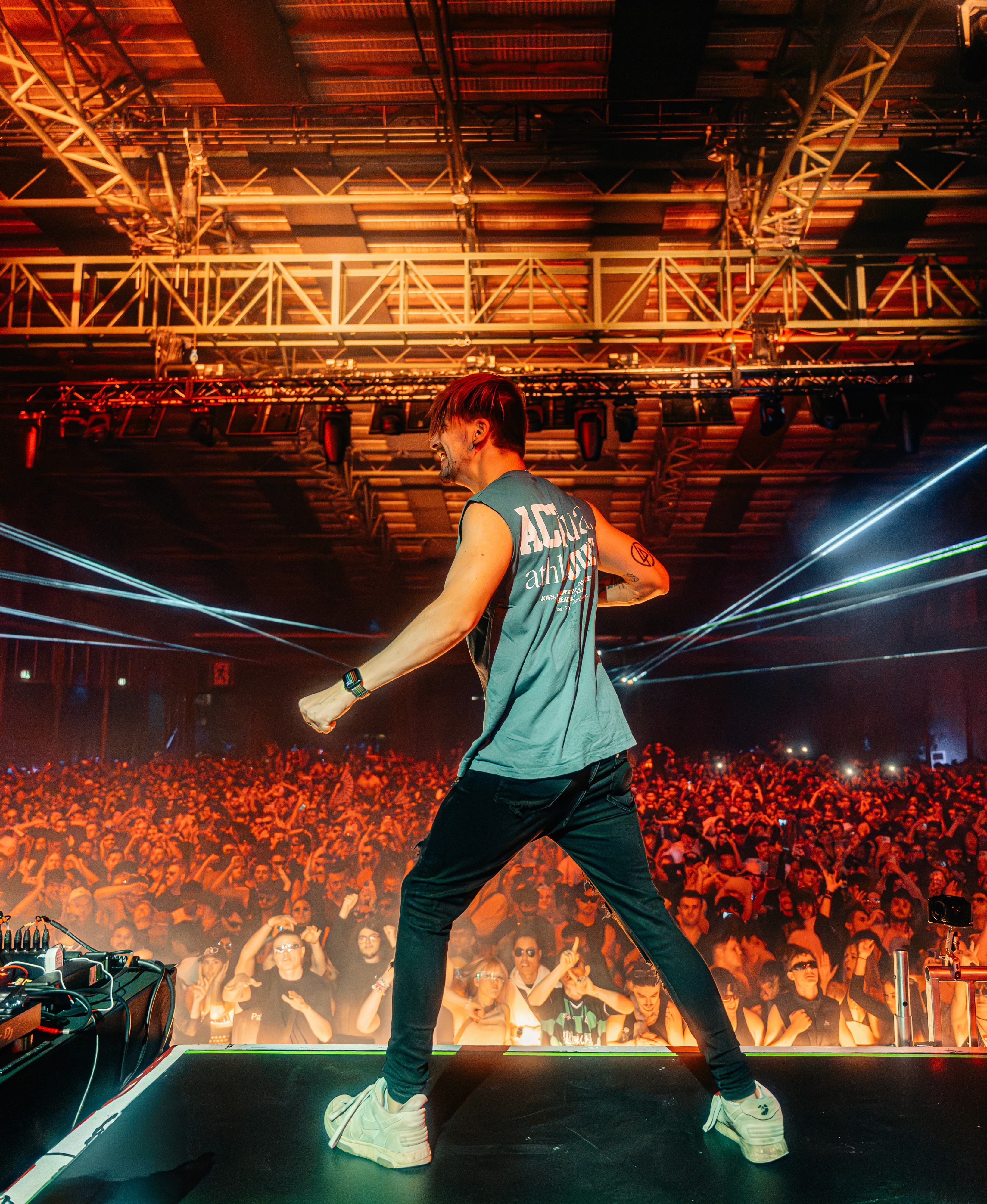 DJ playing to a large crowd at Paradigm Festival