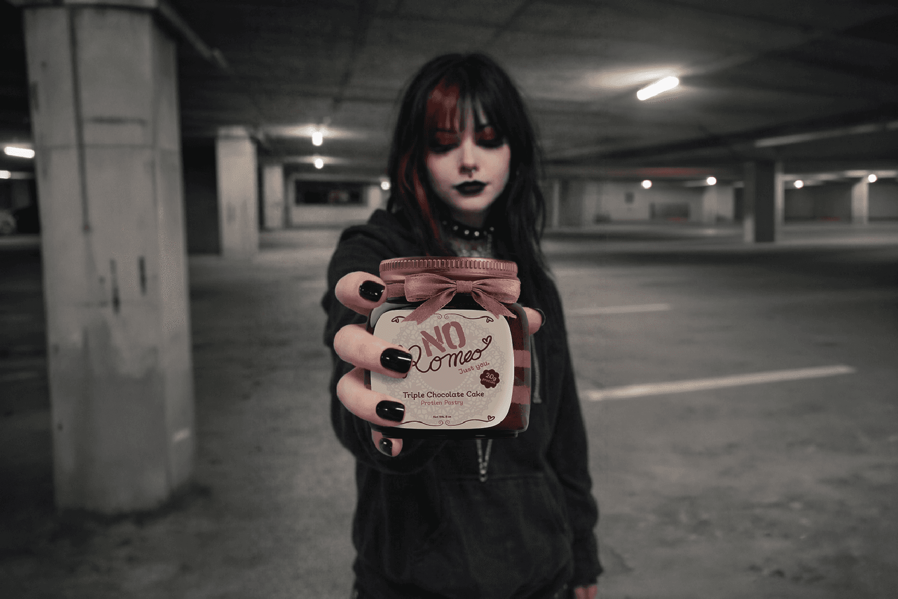 Alt girl holding a No Romeo pastry jar
