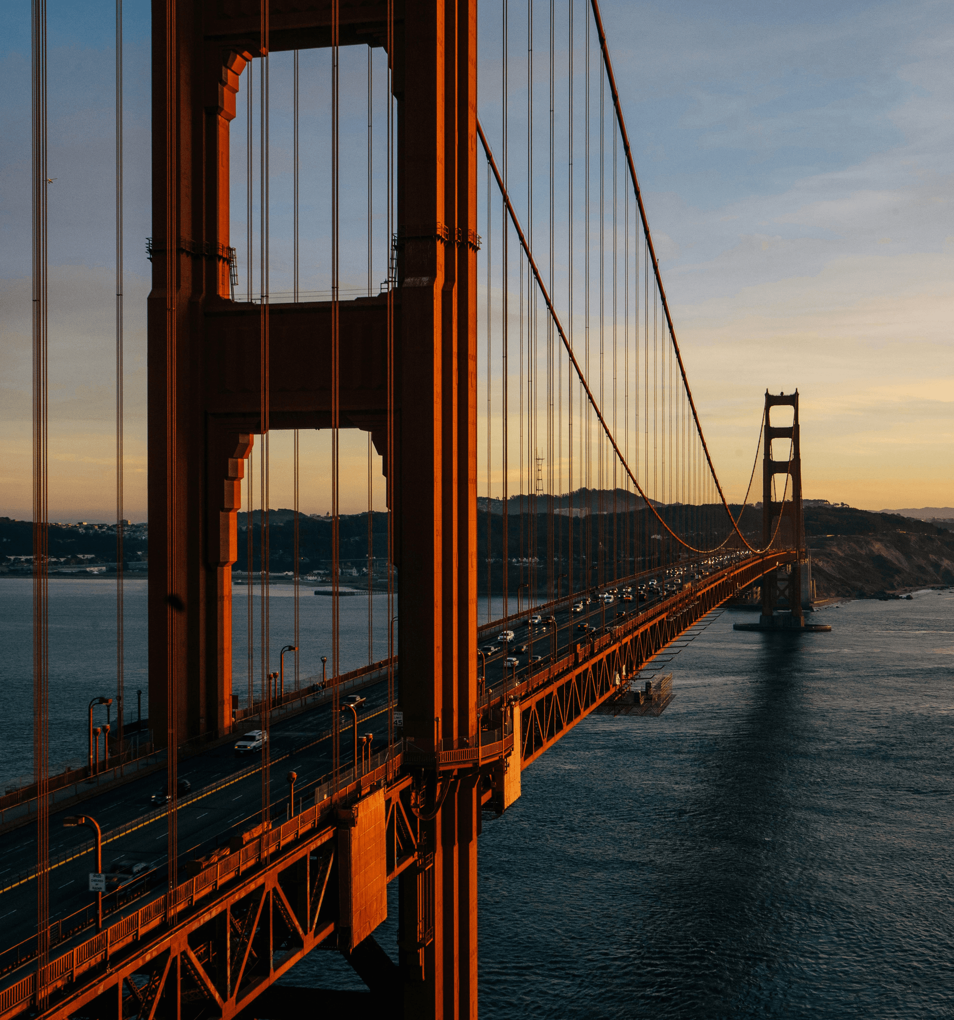 A view of the golden gate bridge at sunset