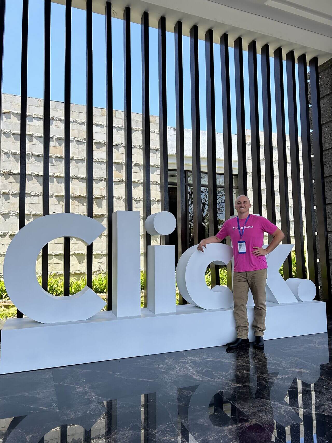 man in front of Click sign