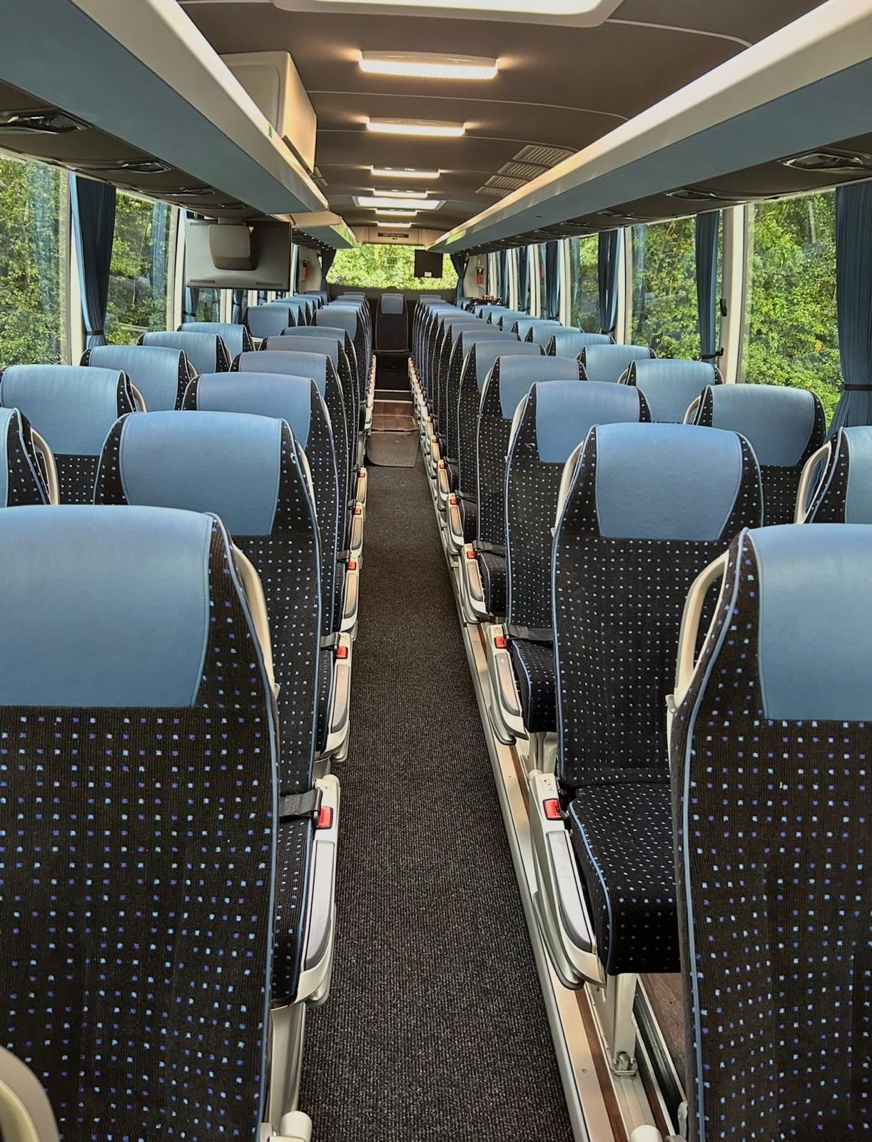 Luxury coach and minibus fleet used for city tours and private transfers, showcasing premium travel services and modern design in urban and scenic environments