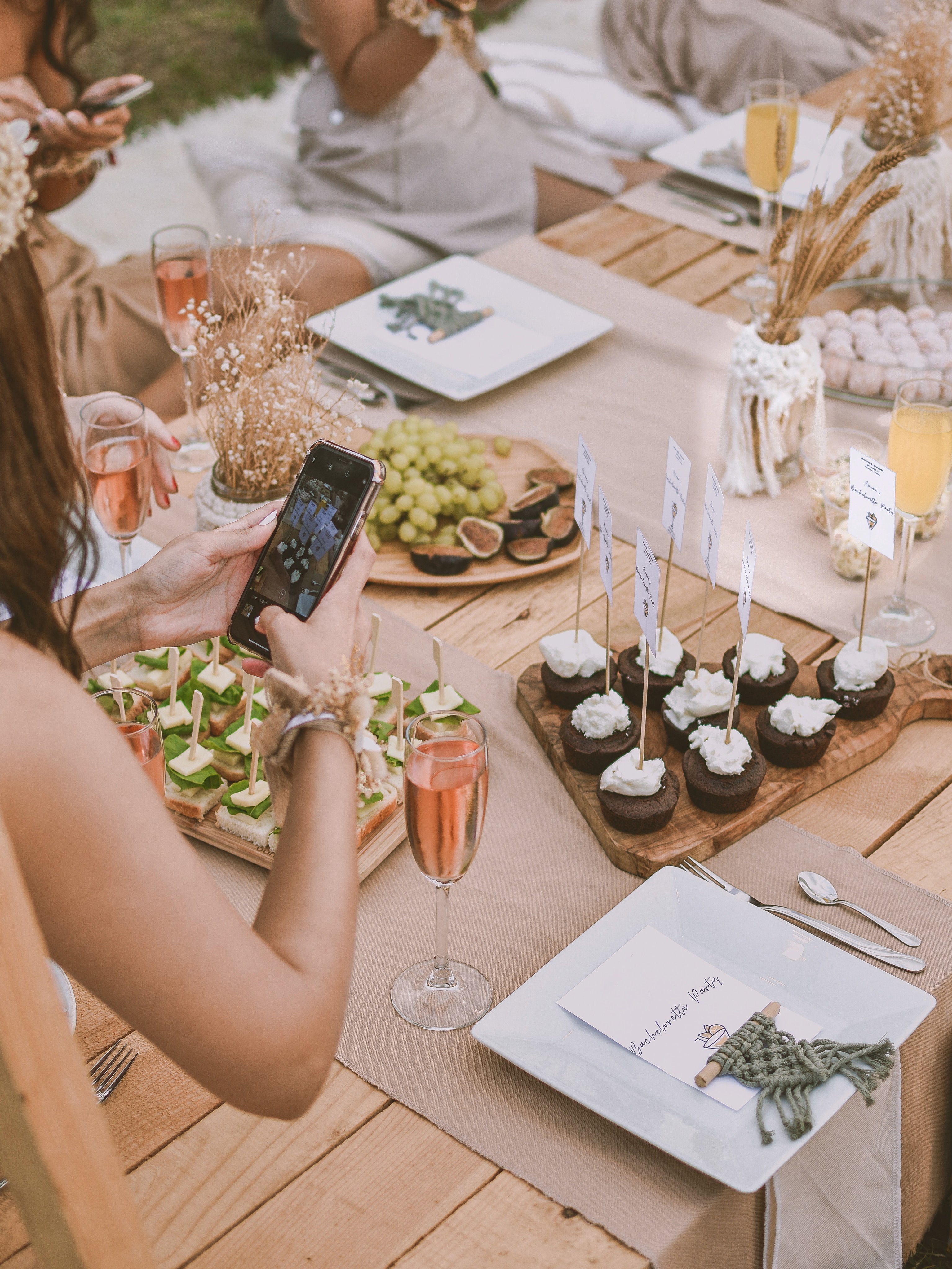 Woman taking pictures of food on her phone