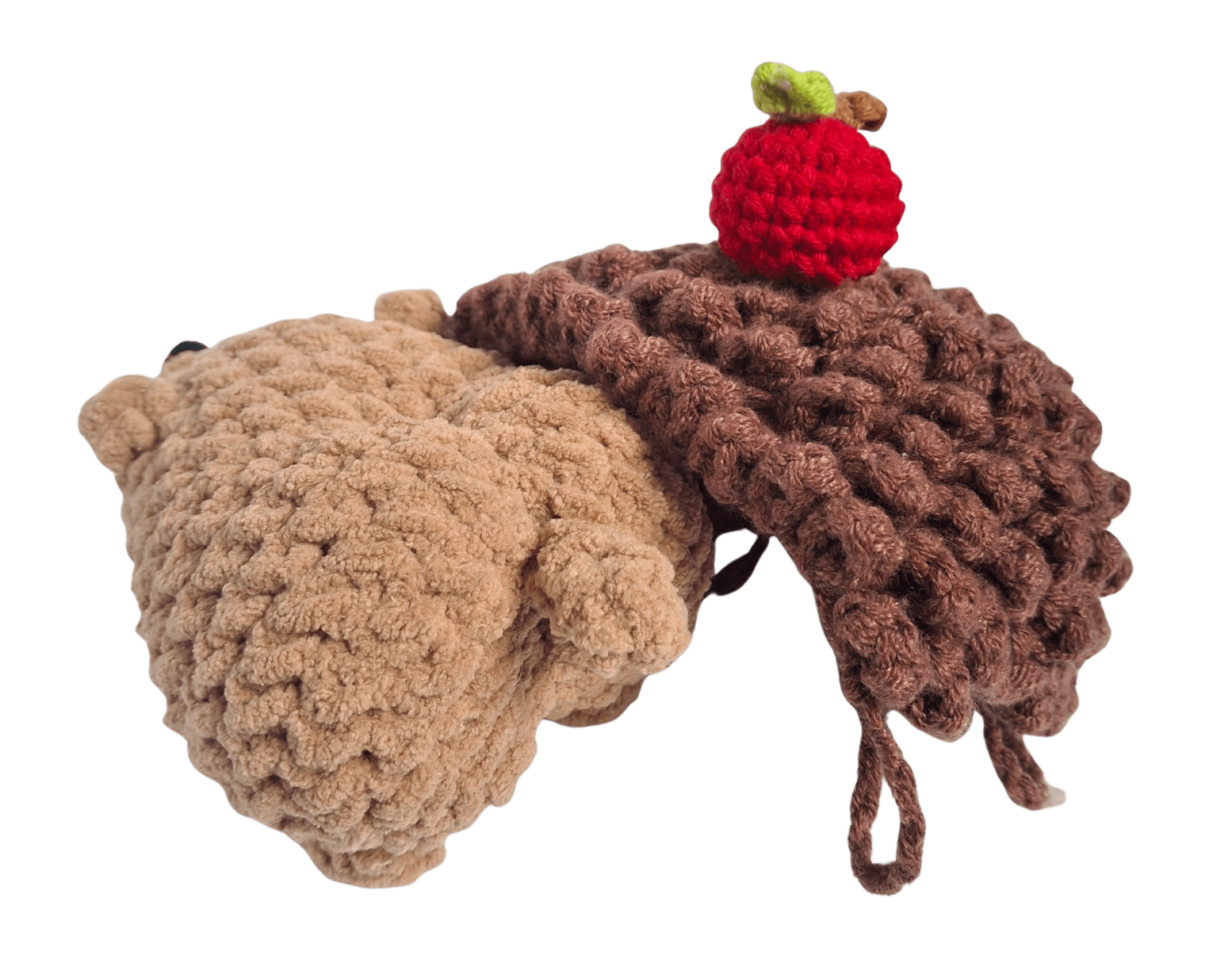 A cute, handcrafted plush hedgehog toy with brown yarn spikes and large, friendly eyes sits facing forward on a white background.