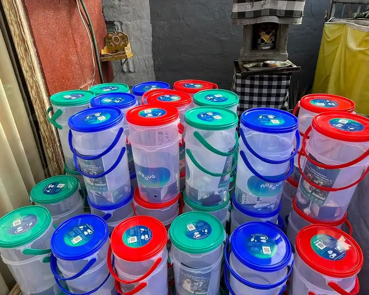 Stacks of  water filters with colorful lids ready for community distribution across Bali.