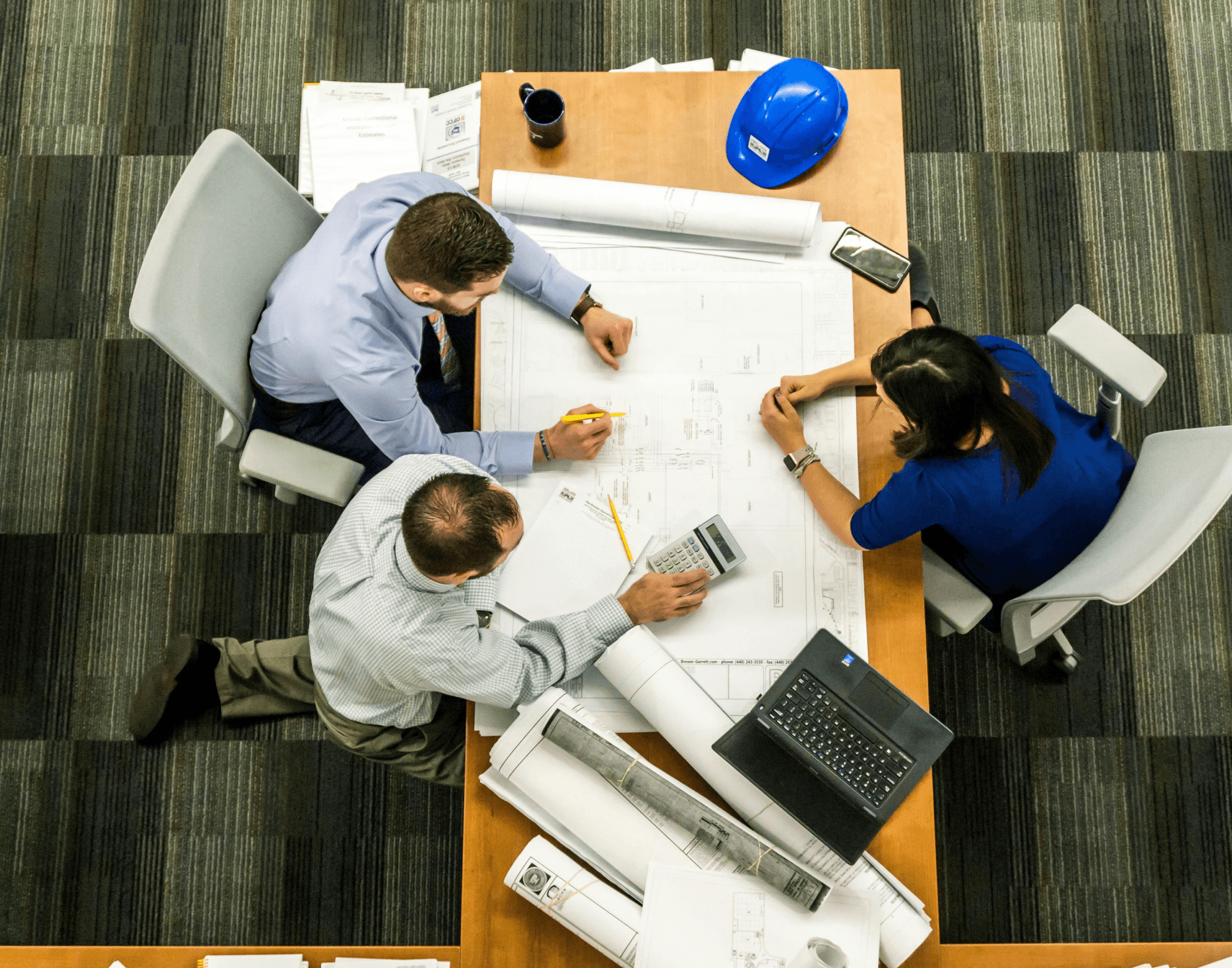 Architects reviewing blueprints