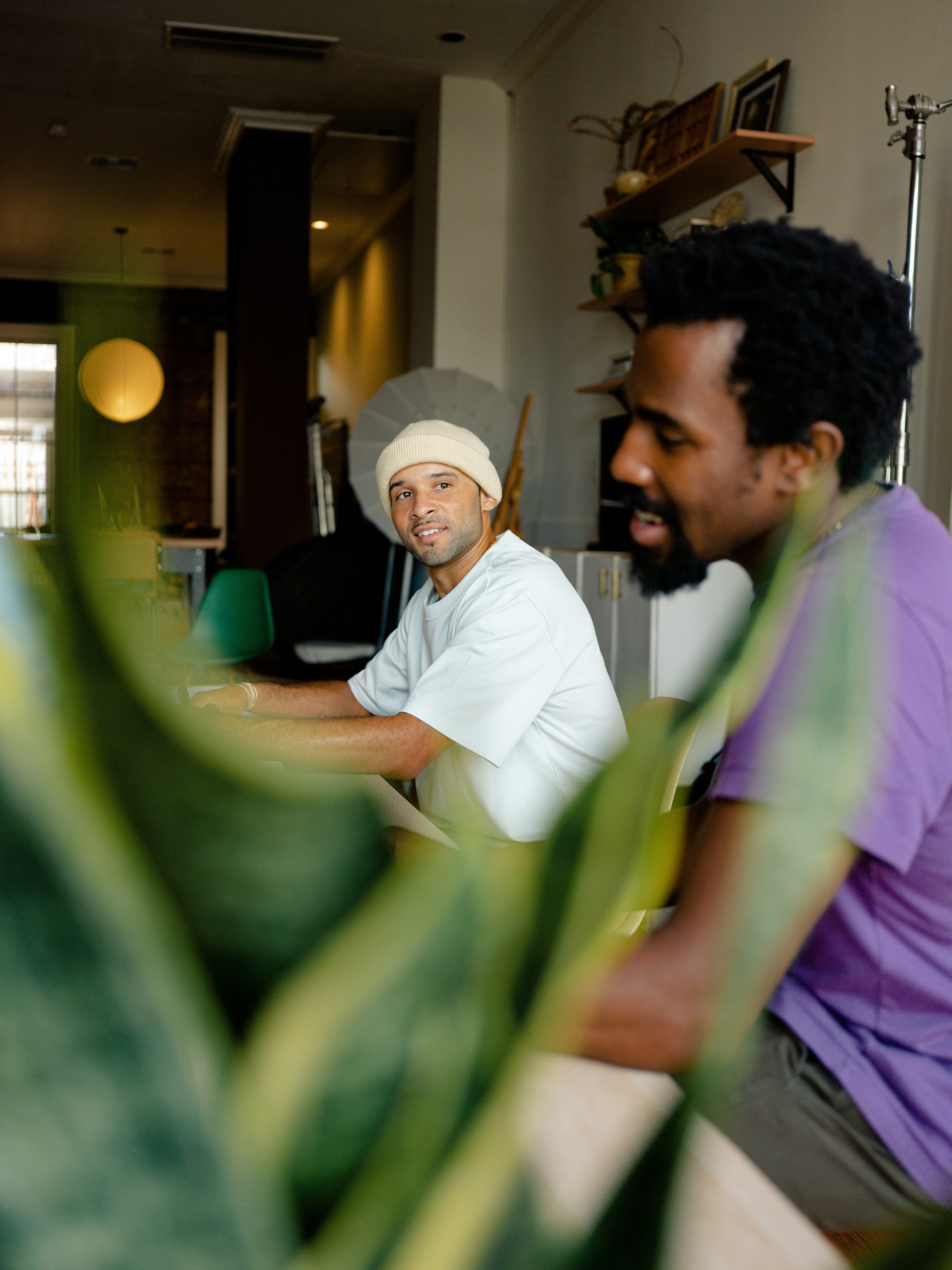 Man with a laptop walking to a store
