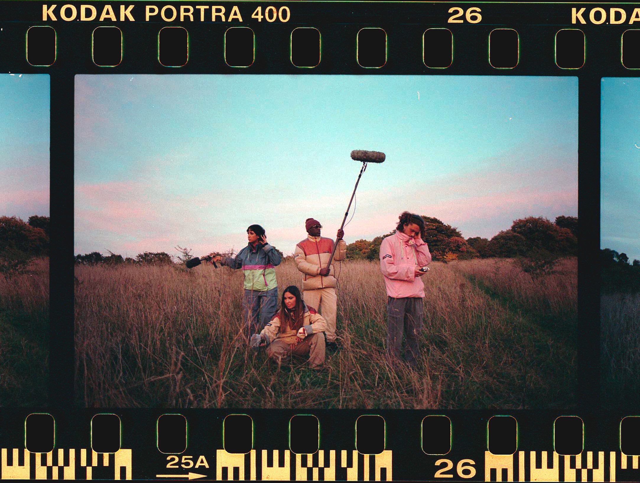 White branded cap with turquoise logo placed on fresh lemons in a red bowl