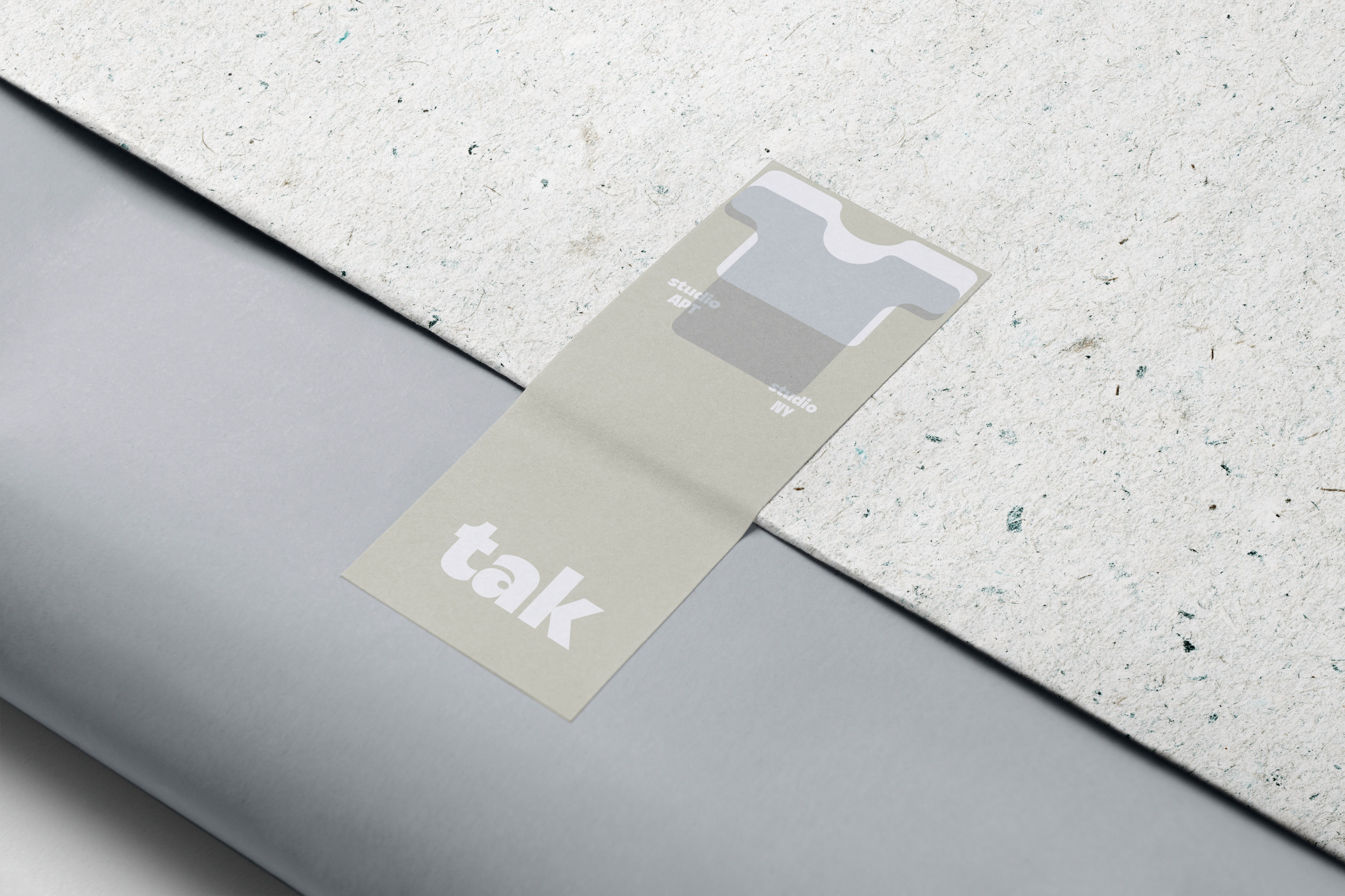 Label for a fictional clothing brand "tak""