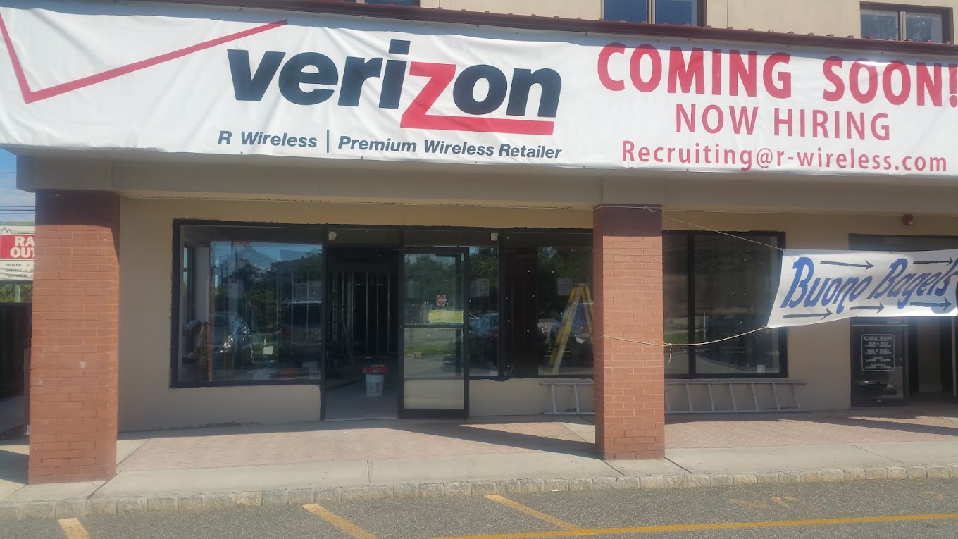 Commercial storefront glass windows and entrance at a Verizon retail store