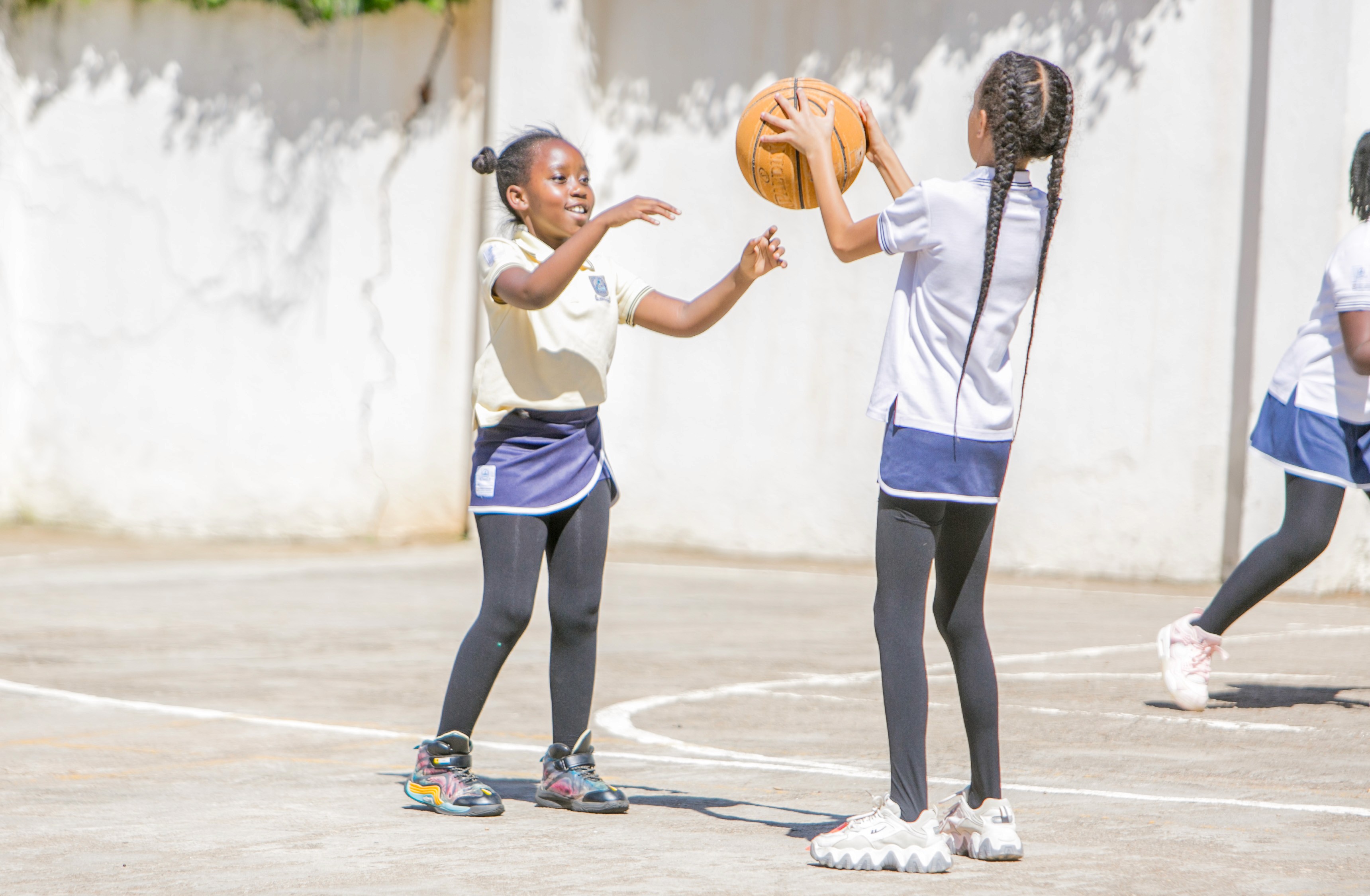 A student is working on a tablet, focused on the screen