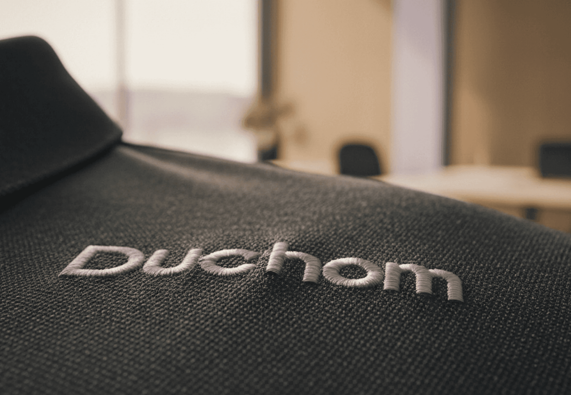 closeup of embroidery onto a polo t shirt, for company employees and clients