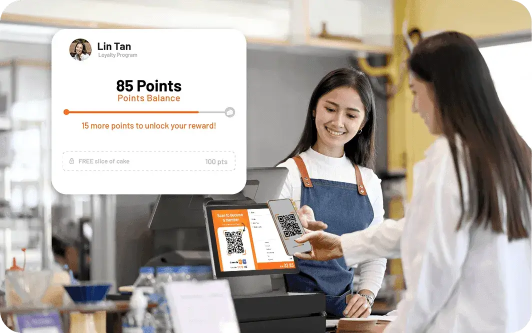 A Malaysian café customer scanning a QR code at StoreHub POS to check membership points and redeem rewards.