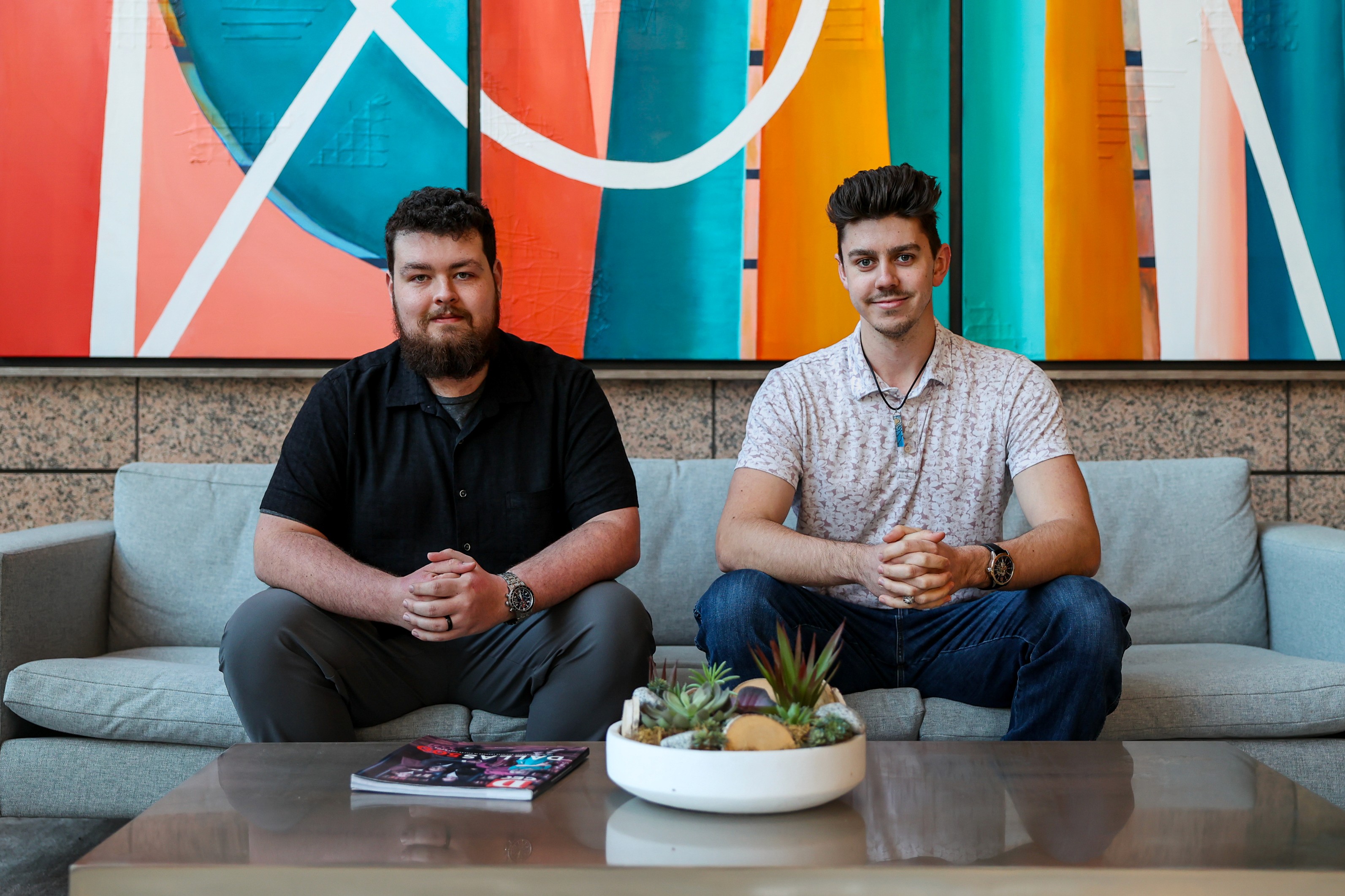The founders of That One Tech Company sitting on a couch, Kyle Johnson (right) and Nick Spaur (left).