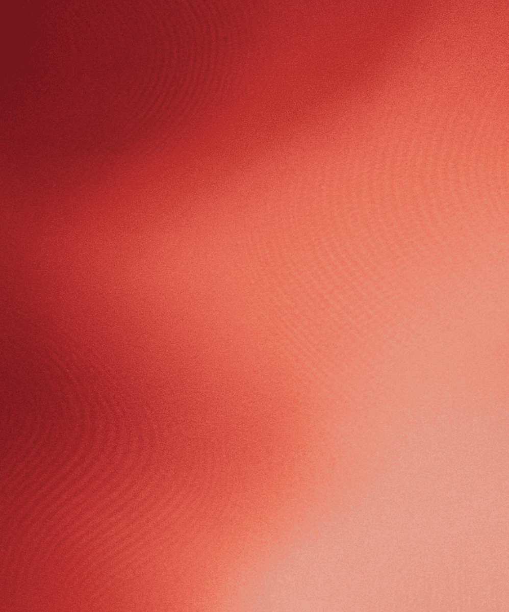 Abstract gradient background with warm shades of red and peach, creating a smooth, flowing texture.