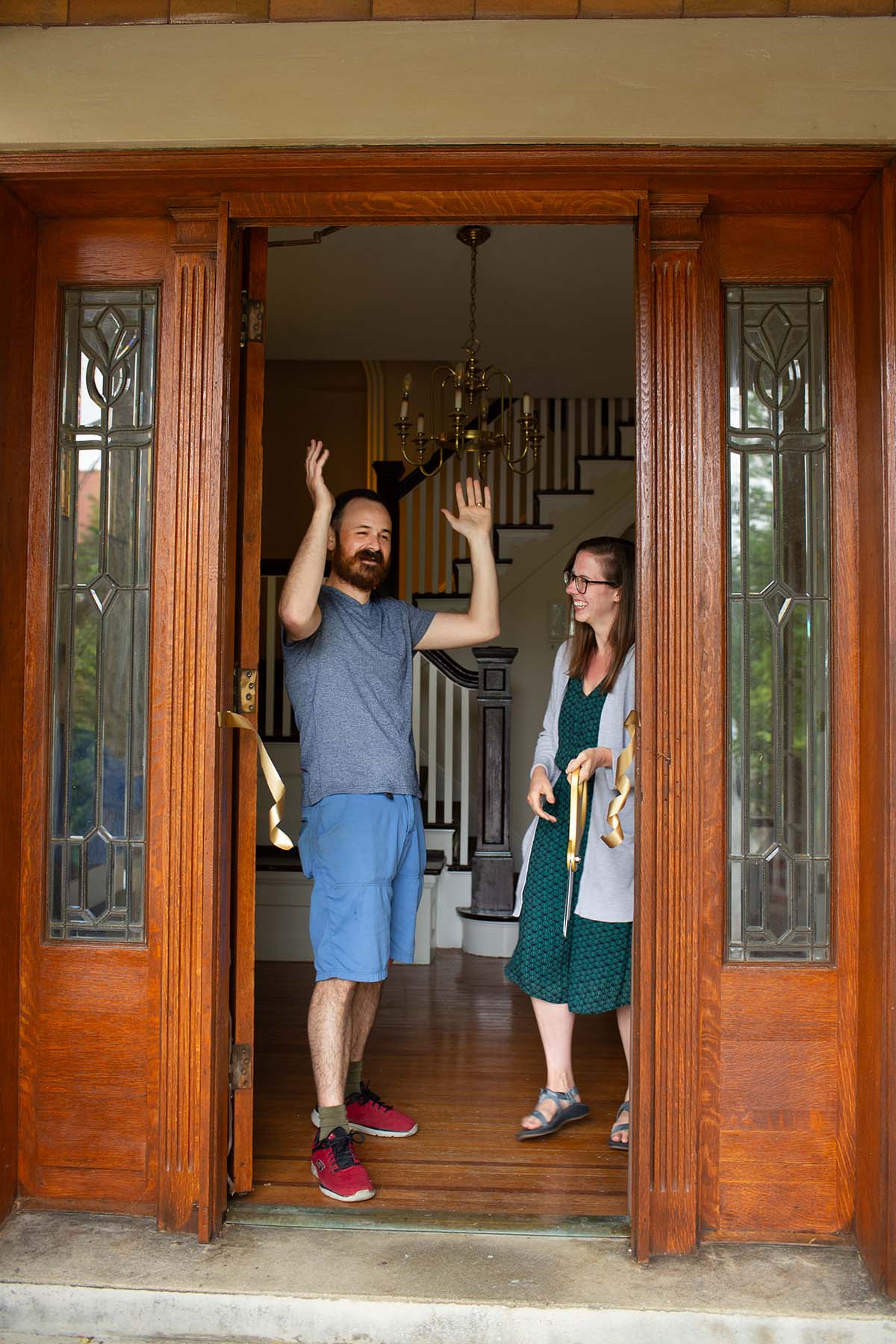 A man and woman celebrating the purchase of a new Cincinnati historic home in Clifton