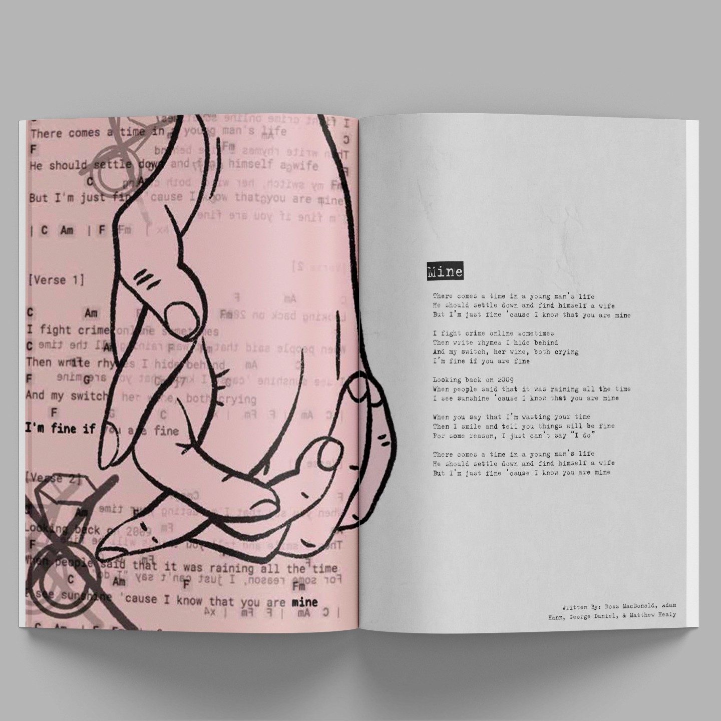 magazine with black and pink design laying on grey background, illustration of people holding hands