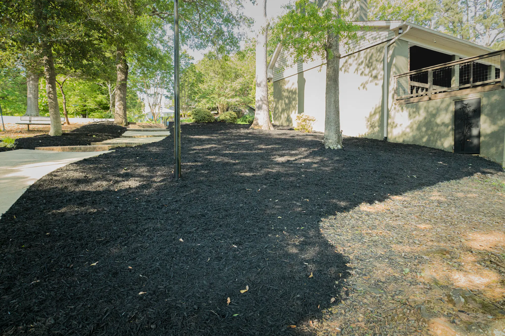 Professional lawn mowing service maintaining a residential yard in Greenville SC