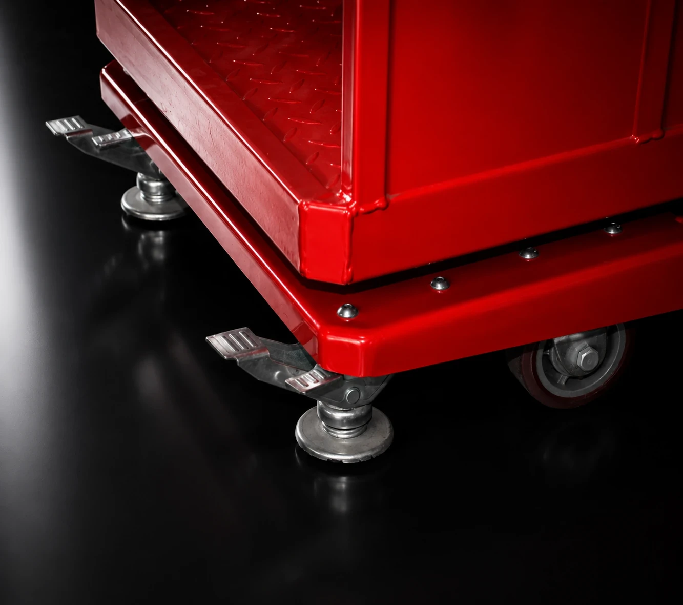 Manual stabilizer legs and ZTR caster wheel on red lift platform