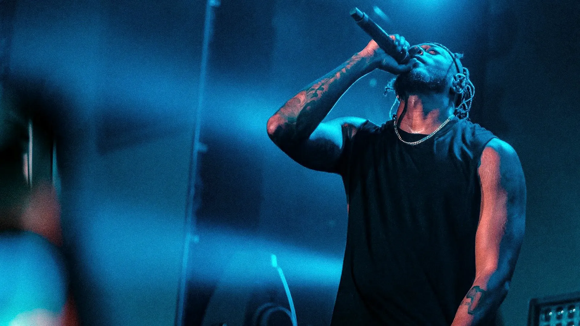 Lecrae performing at a concert