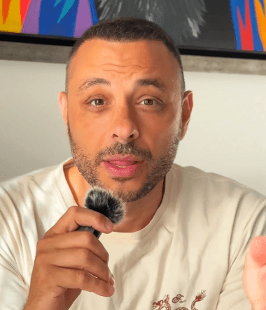 A person in a blacl coat and the brown hairs