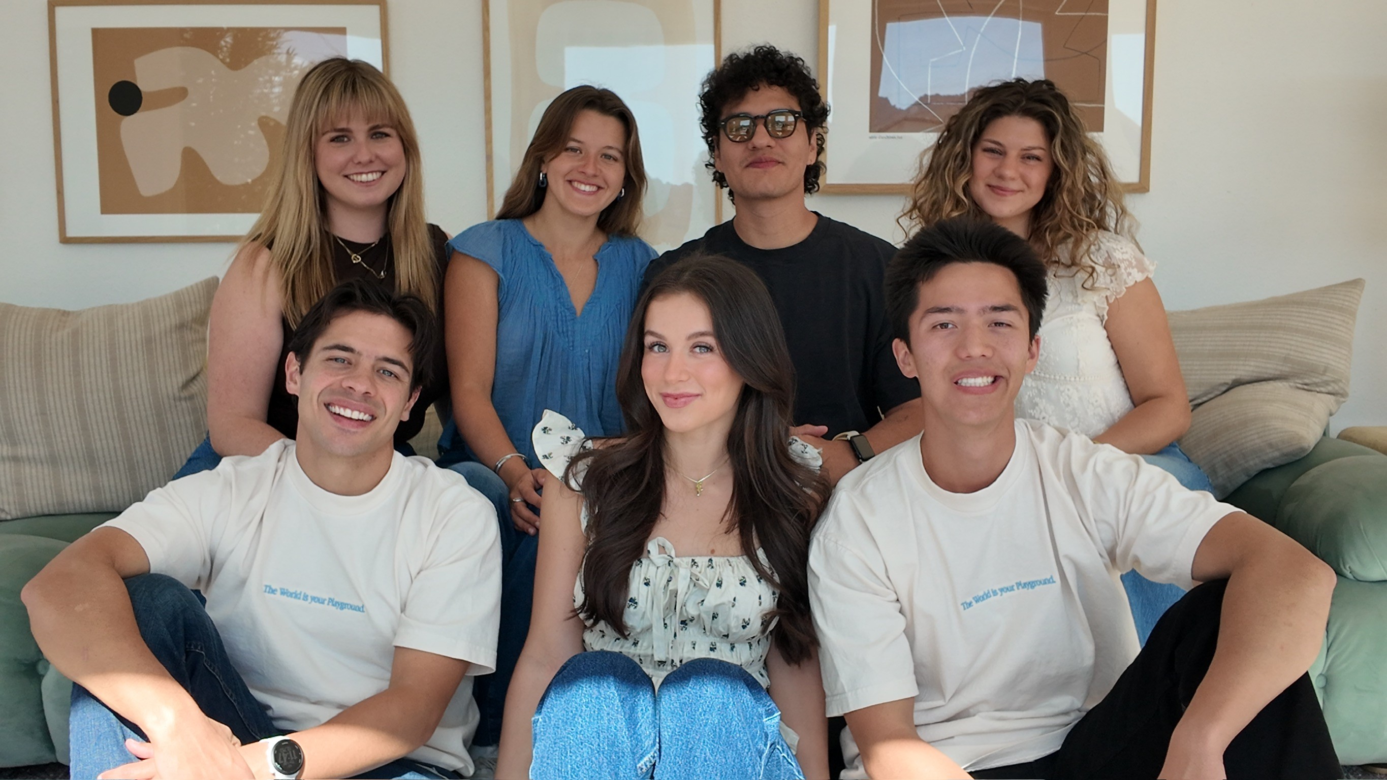 Playkit core team members gathered together during the company retreat, smiling on an outdoor patio with relaxed and friendly energy.