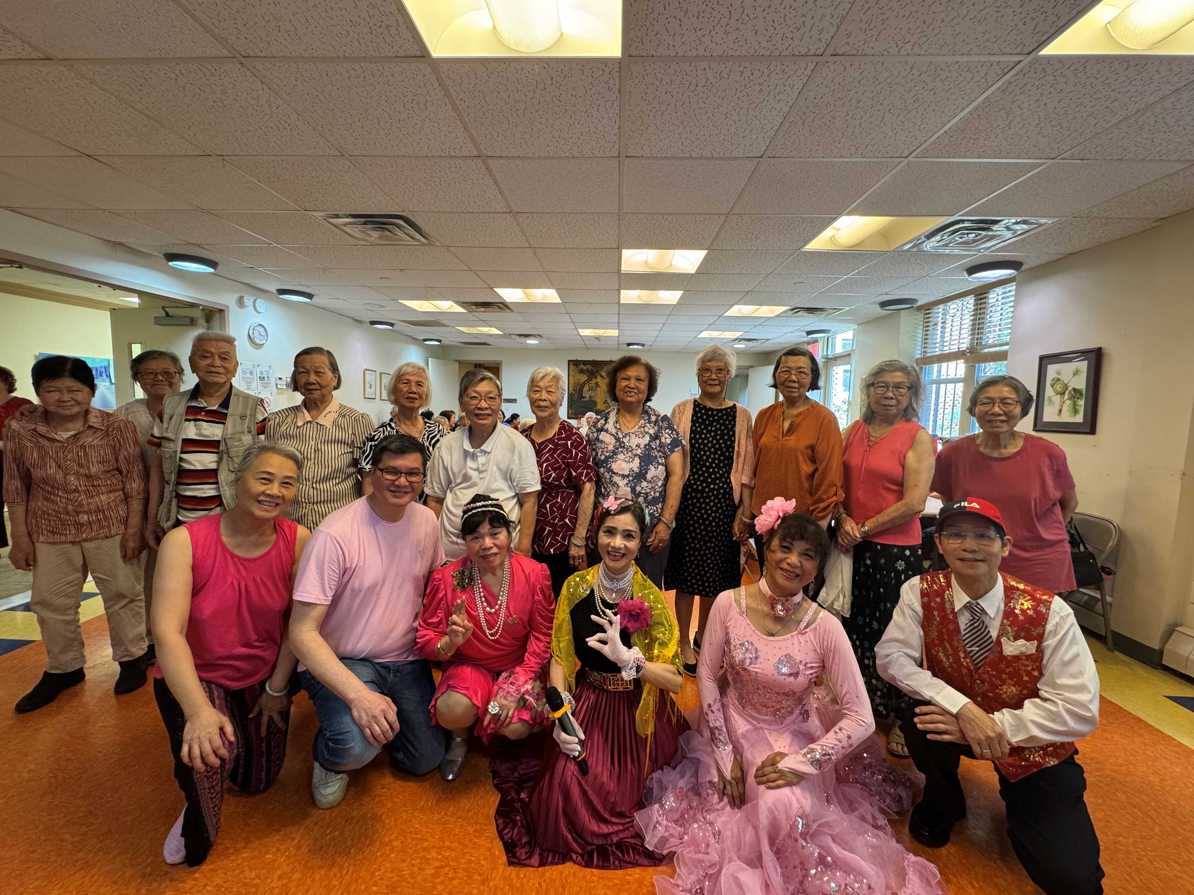 Seniors in traditional and casual garb celebrating a cultural holiday.