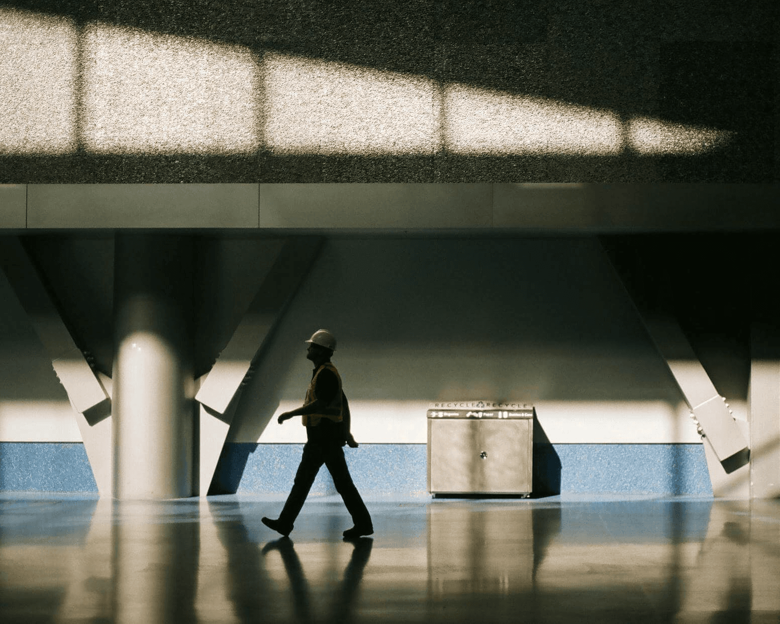 a man holding a large hammer in a room
