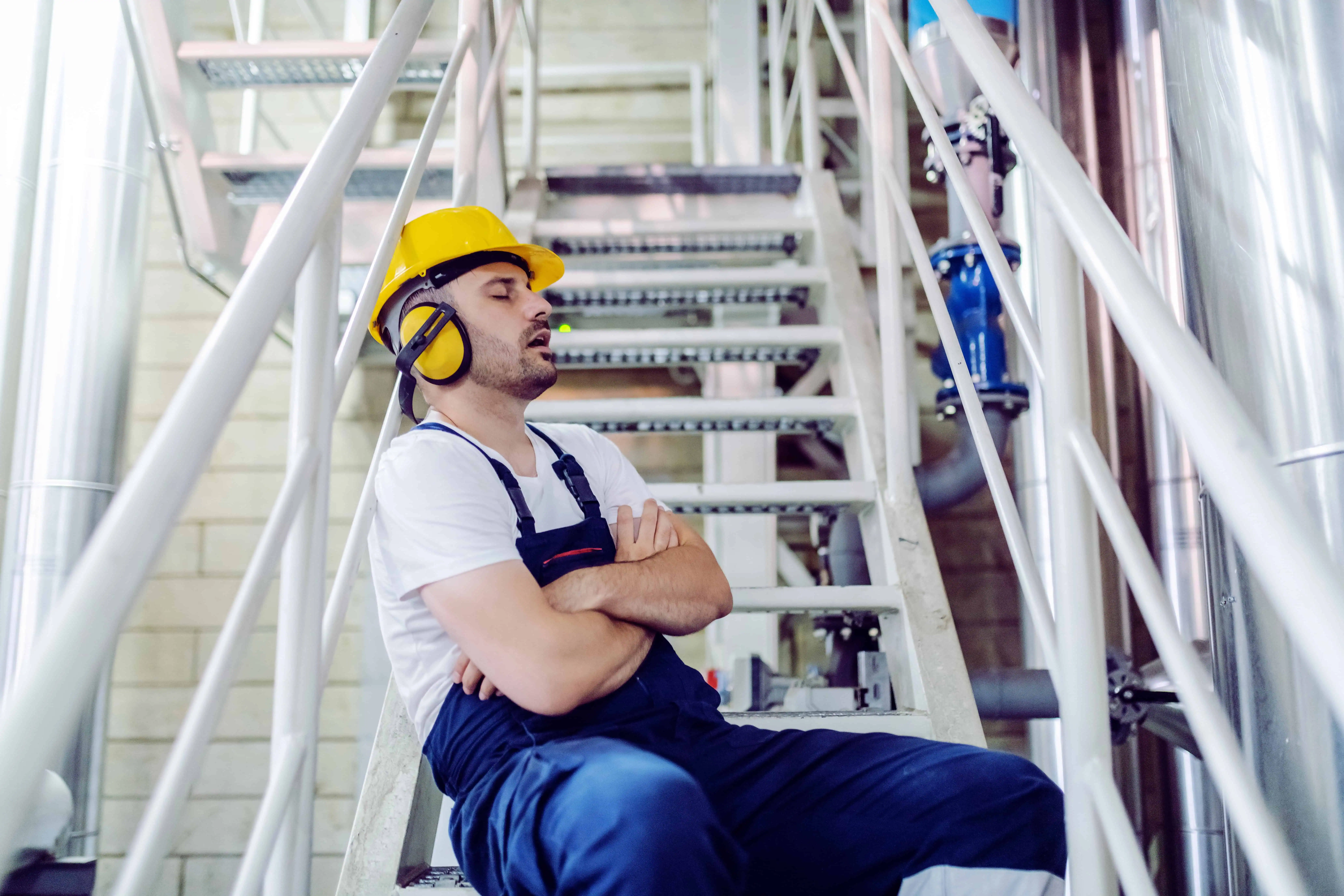 Engine room operator sleeping due to being fatigued on an oil platform