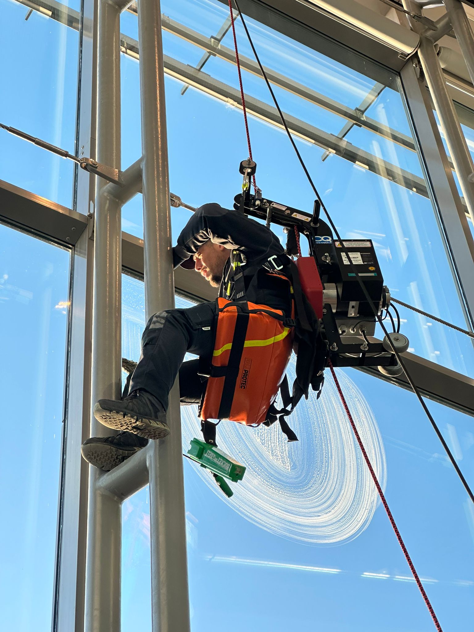 woman in gray hijab and gray coat
