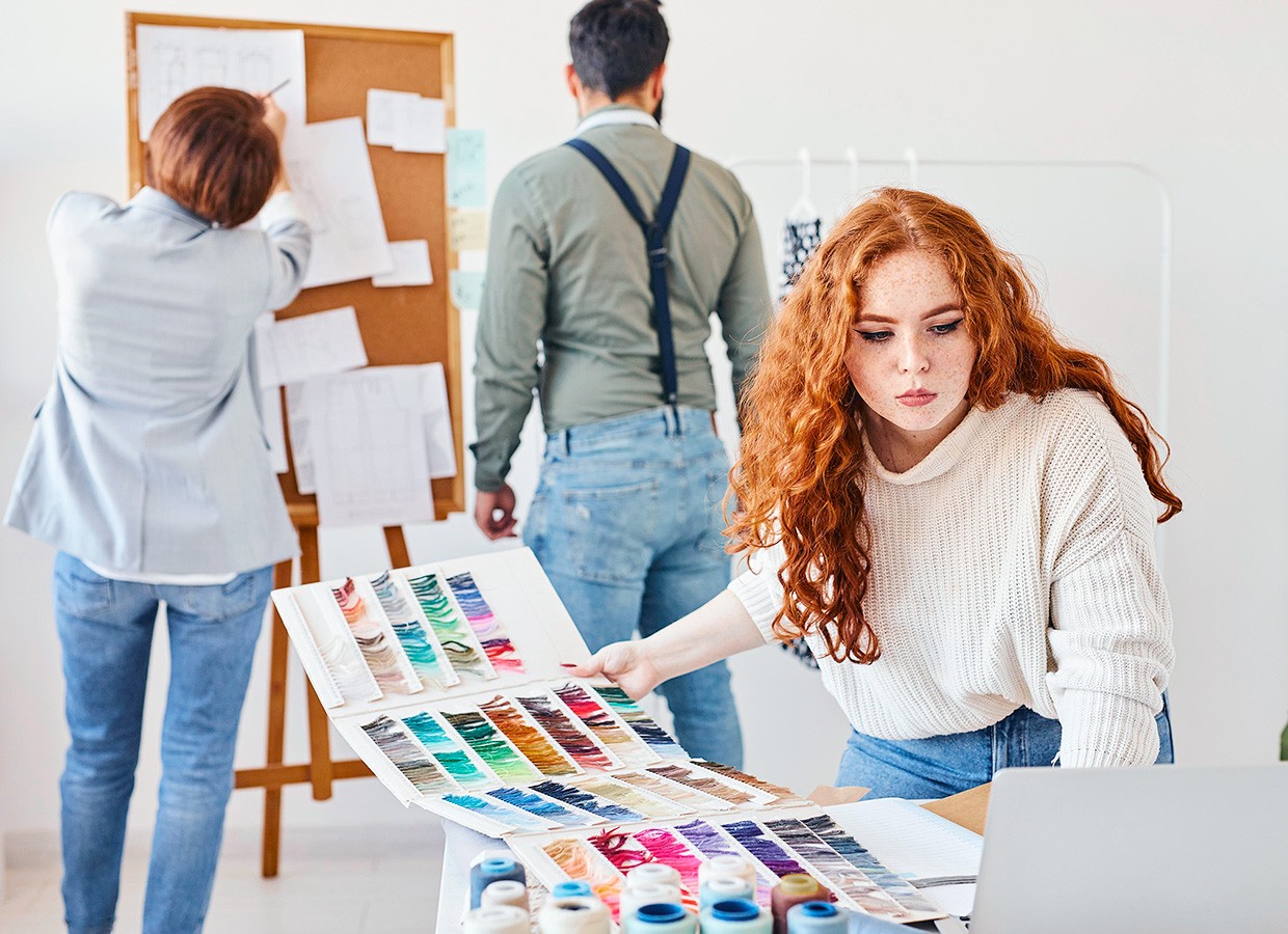 group fashion designer working atelier with color palette idea board