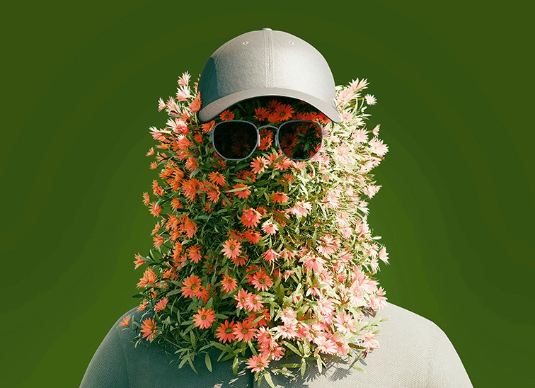 Person with face covered in flowers and wearing a hat, representing creativity, perception, and brand expression.