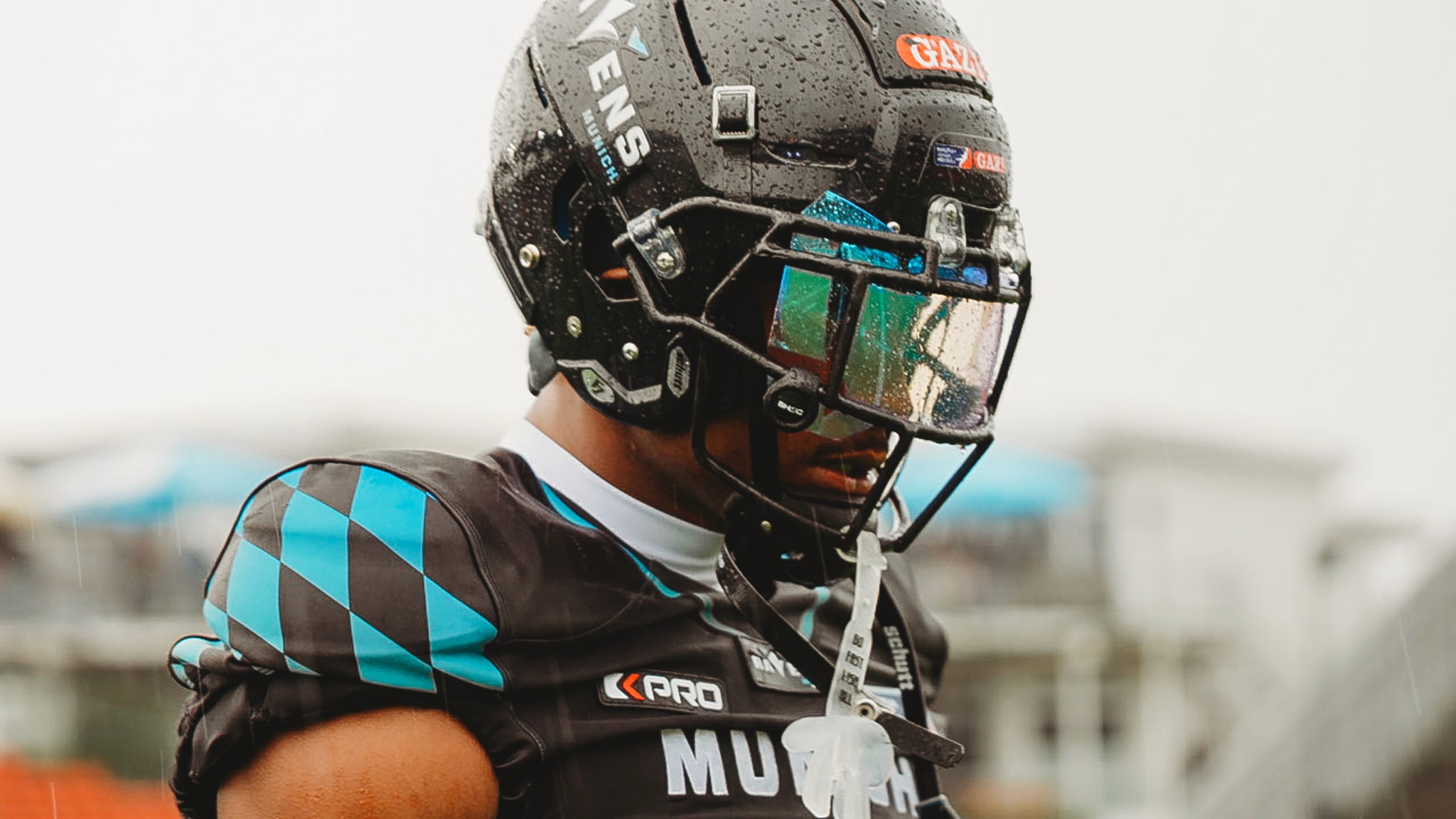 football player side profile wearing a helmet