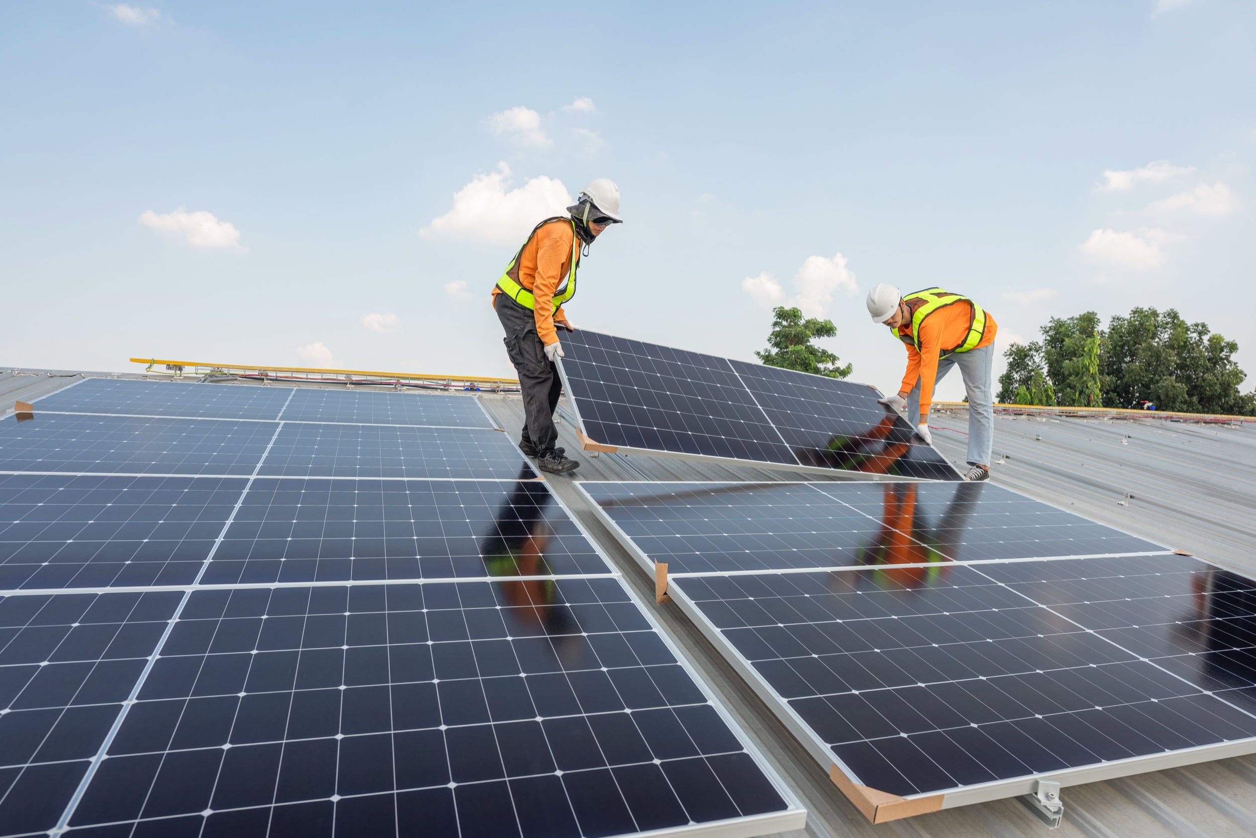 the roof of a building with a lot of solar panels on it
