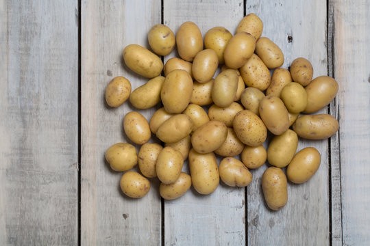 two people looking at a tablet and smiling
