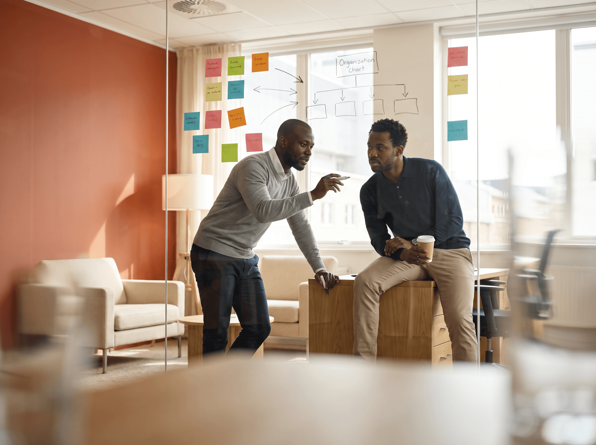 African startup founders assessing team plans at a whiteboard